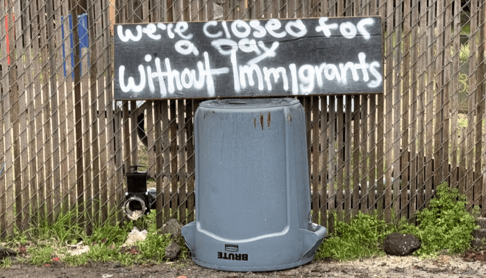 a sign about "a day without immigrants"